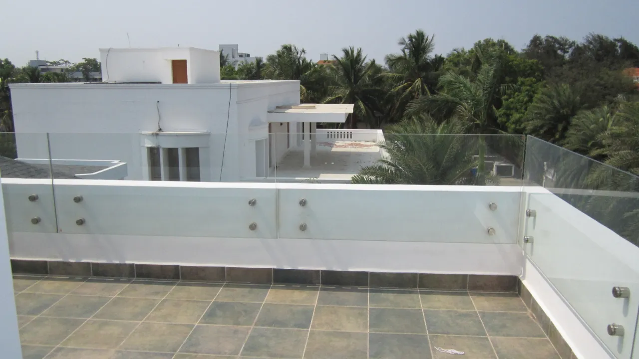 Frameless toughened glass railing on a terrace in Chennai